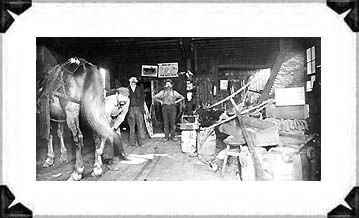 Blacksmith shop, early 1900's with Robert A. Fielder, Sr. on the left.